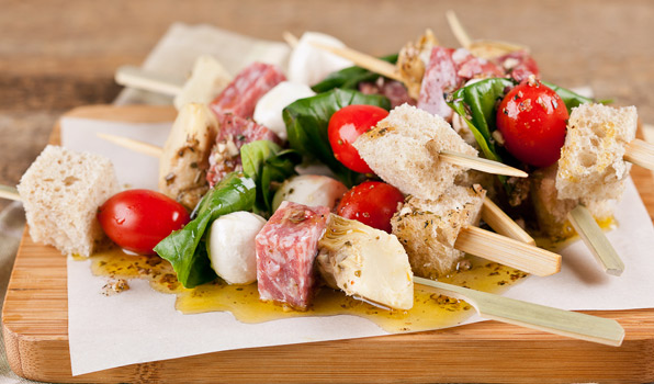 in the kitchen with stefano faita antipasto skewers served with dressing drizzled over them