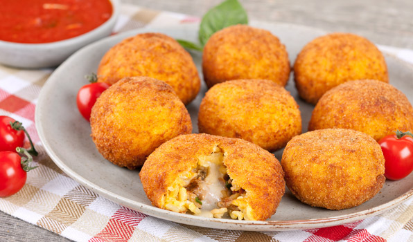 in the kitchen with stefano faita italian rice balls with tomato sauce served on a plate