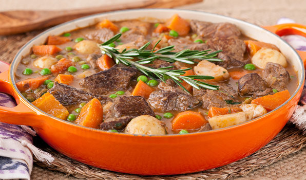 in the kitchen with stefano faita stefano's quick beef stew in a pot garnished with a sprig or rosemary