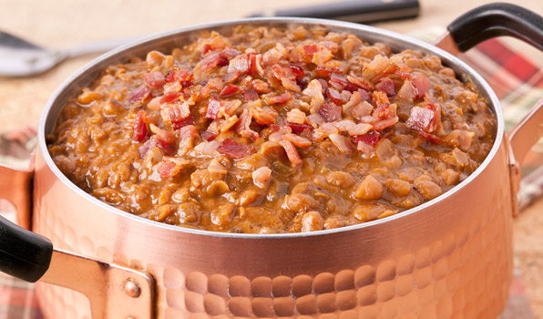 in the kitchen with stefano faita boston baked beans served in large pot with bacon bits on top