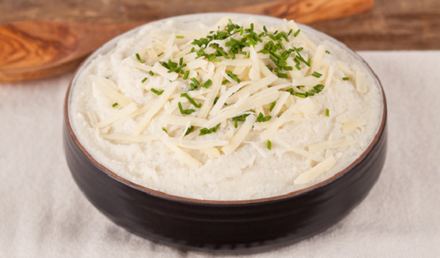 in the kitchen with stefano faita cheesy mashed cauliflower served in a bowl and garnished with chopped chives