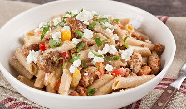 in the kitchen with stefano faita creamy sausage and pepper pasta served and garnished with some chopped parsley and a drizzle of olive oil