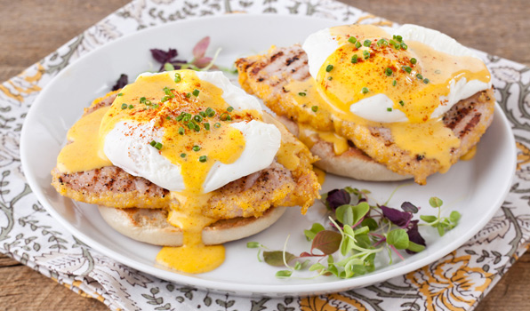 in the kitchen with stefano faita stefano's eggs benedict served on english muffins, garnished with cayenne, chopped chives and micro greens