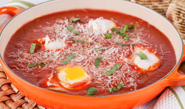 in the kitchen with stefano faita eggs in purgatory in an orange saucepan