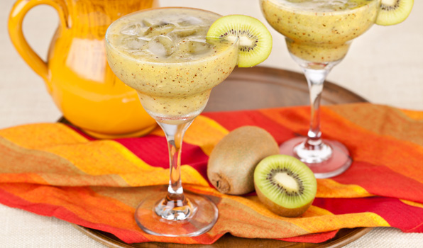in the kitchen with stefano faita kiwi magarita poured into glasses and each glass garnished with a slice of kiwi