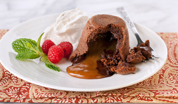 in the kitchen with stefano faita chocolate dulce de leche lava cakes with cinnamon whipped cream and a dusting of icing sugar