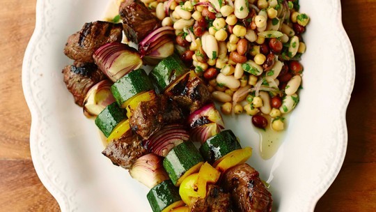 gino's italian escape marinated meat skewers with a three bean salad on the side