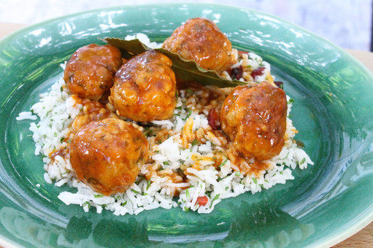 gino's italian escape herby veal meatballs with parmesan and pine nuts in tomato sauce served on top of a bed of rice