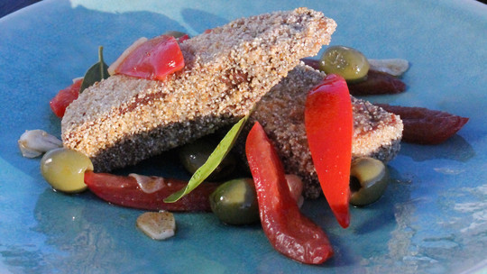 gino's italian escape semolina crusted fresh tuna served with sliced plum tomatoes and green olives