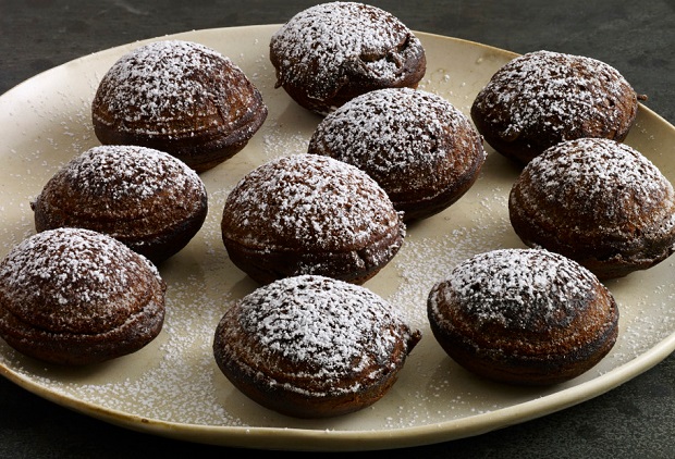 pati's mexican table mexican chocolate donuts served on plate with powdered sugar on top