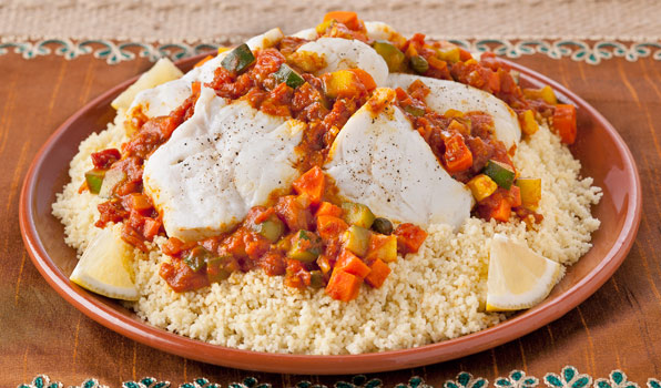 in the kitchen with stefano faita moroccan fish stew served on a bed of steamed couscous with lemon slices