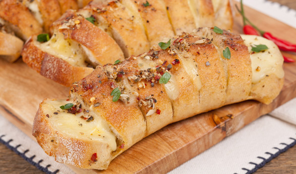 in the kitchen with stefano faita mozzarella garlic bread served on a wooding board