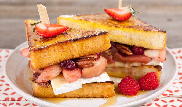 in the kitchen with stefano faita pear and brie french toast sandwich on a plate dusted with icing sugar and drizzled in maple syrup