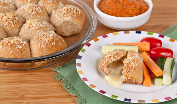 in the kitchen with stefano faita pizza bites with tomato dipping sauce served with carrot and cucumber sticks and cherry tomatoes