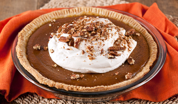 in the kitchen with stefano faita stefano's pumpkin pie garnished with whipped cream, chopped pecans and cinnamon