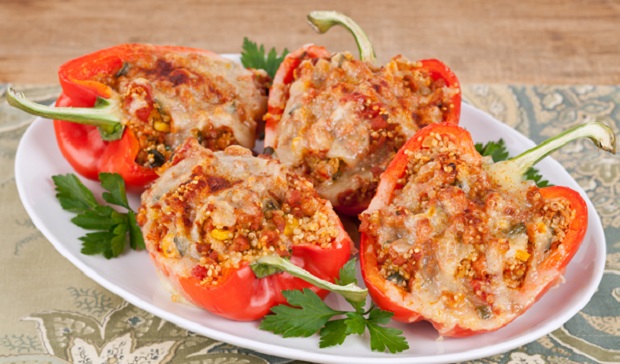 in the kitchen with stefano faita quinoa and sausage stuffed pepper served on a plate with parsley