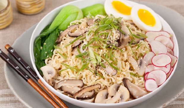 in the kitchen with stefano faita ramen noodle mushroom soup served in a white bowl on a plate with a pair of chopsticks