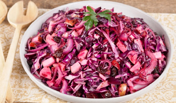 In the kitchen with Stefano Faita red cabbage and apple salad in a white bowl with wooden utensils