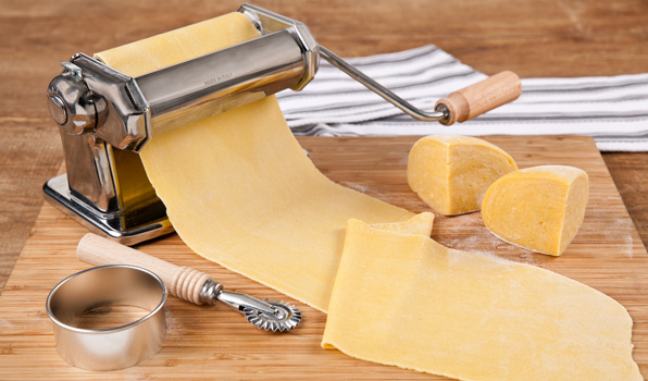 in the kitchen with stefano faita basic pasta dough in a pasta machine with parmesan on the side