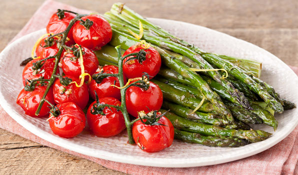 in the kitchen with stefano faita roasted cherry tomatoes and asparagus served on a dish