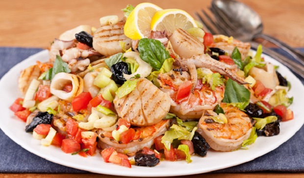 in the kitchen with stefano faita grilled seafood salad with lemon and utensils on the side