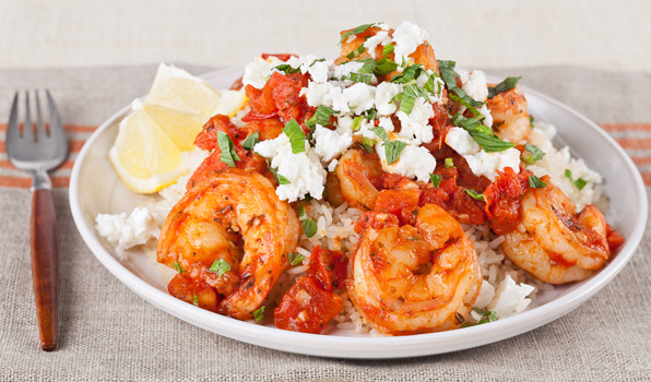 in the kitchen with stefano faita skillet shrimp with feta and tomato served over rice, drizzled with lemon juice and sprinkled with feta and mint