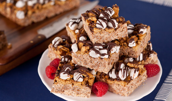 in the kitchen with stefano faita toasted marshmallows s'more bars stacked on a plate with raspberries