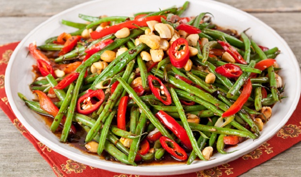 in the kitchen with stefano faita stir fried garlic green beans in a white dish