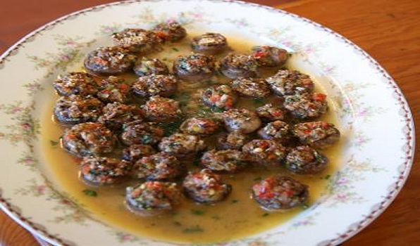 Lidia's Italy in America stuffed mushrooms served on a dish