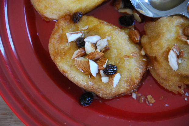 pati's mexican table yucatan style french toast served with syrup and decorated with raisins and chopped almonds