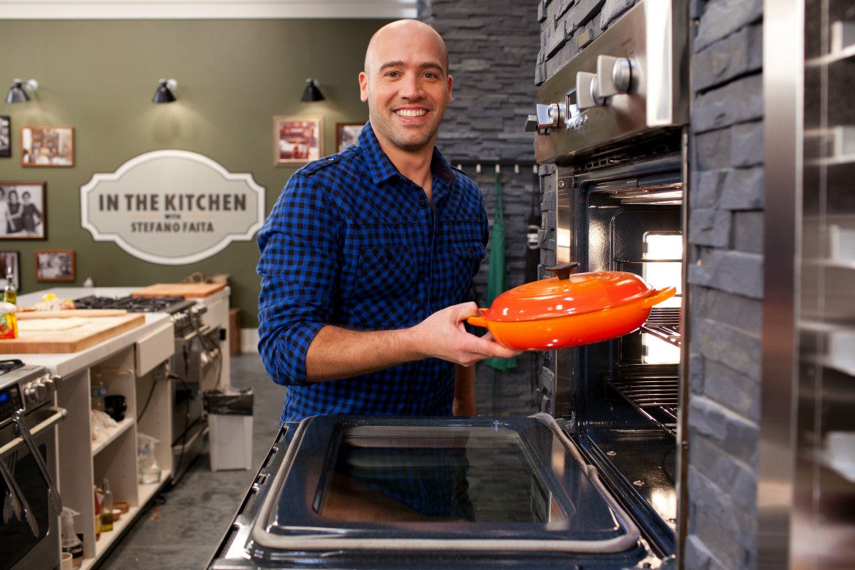 Stefano putting a casserole in the oven