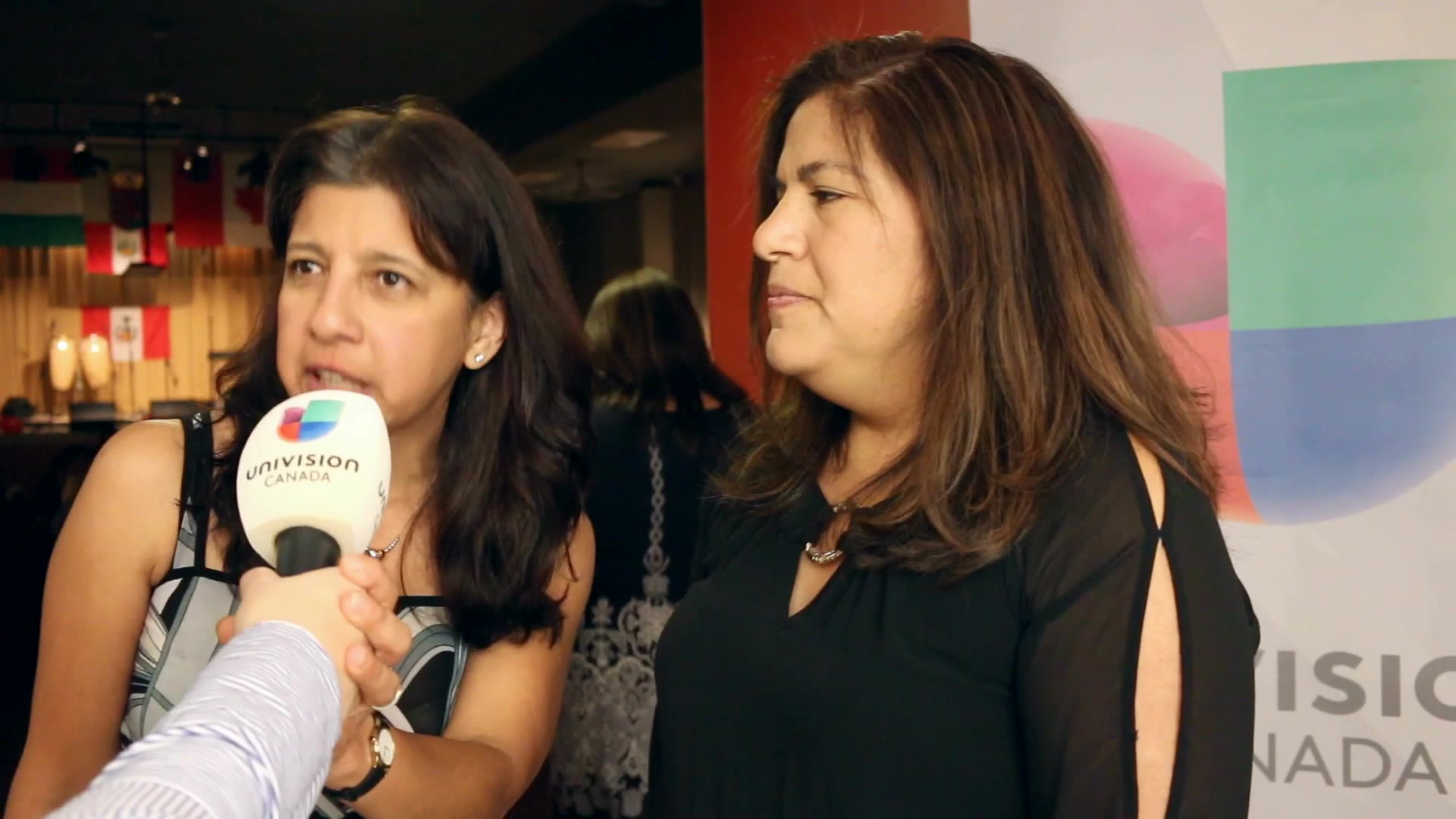 Two women being interviewed