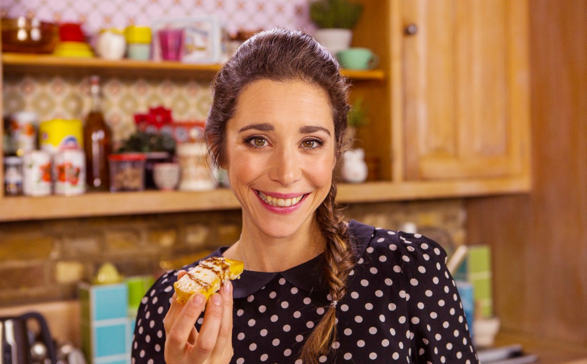 Michela Michela holding a slice of Crispy Polenta with Balsamic glaze