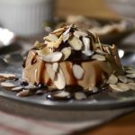 Coffee Panna Cotta with Almonds and Chocolate Syrup